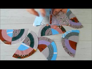 Нарезала 12 разных кругов из лоскутов. Сшила необычный блок "Бычий глаз". Хитрый пэчворк.